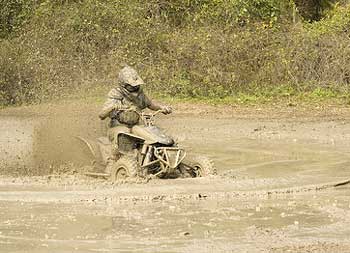 Four wheelers mud bogging